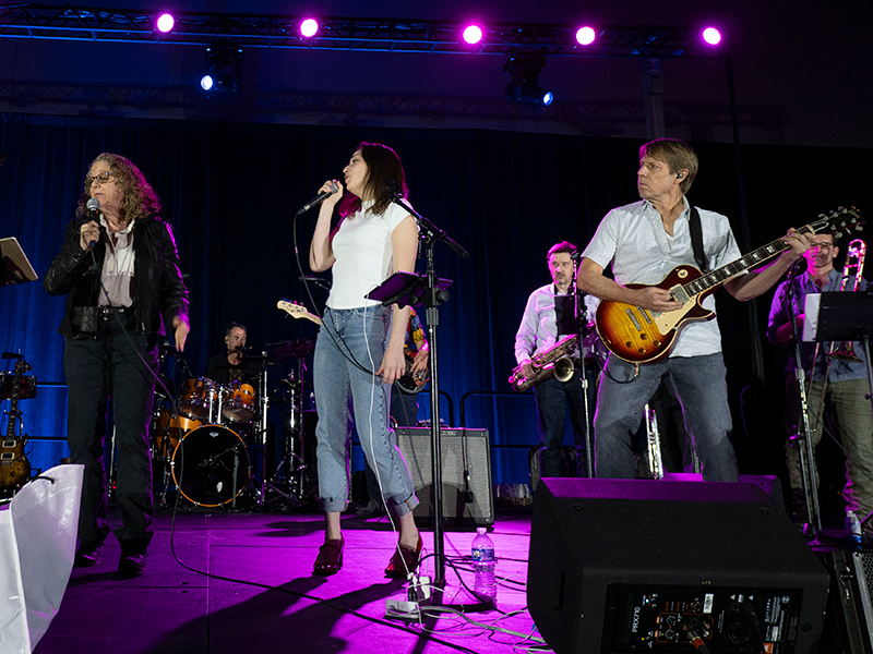 The CheckPoints band performs at the AACR Annual Meeting 2025 in Chicago.
